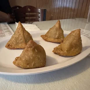 Samosas (cripsy pastry shell filled with vegetables, onion, jalapeno pepper)