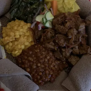 Vegetarian sampler and Awaze beef. Amazing flavors.