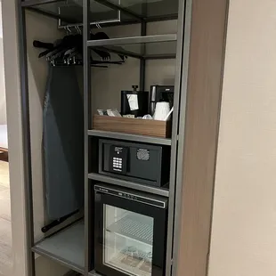 Safe, fridge, and coffee maker.