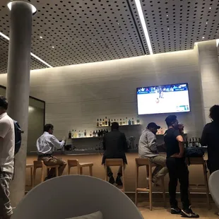 people sitting at the bar