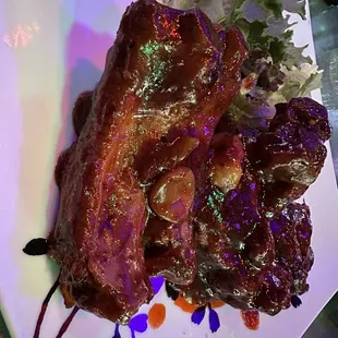 a plate of meat and salad