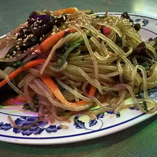 a plate of stir fried vegetables