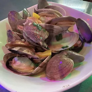 a bowl of clams on a table