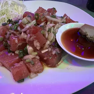 a plate of food with meat and vegetables