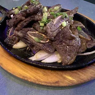 steak and onions in a skillet