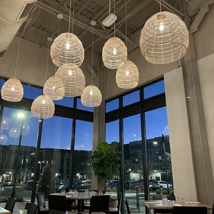 a view of a dining room with large windows