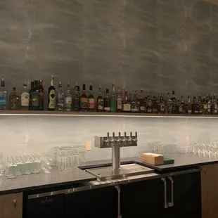 a bar with a lot of liquor bottles