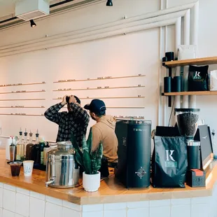 two people standing at a counter