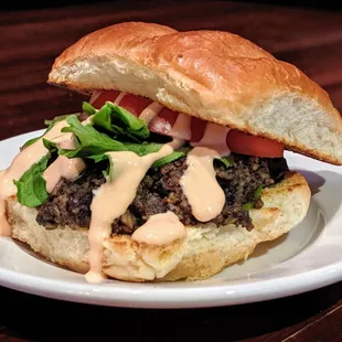 Vegetarian Academy Burger - black bean &amp; mushroom patty, vegetarian Academy sauce, lettuce, tomato with side. In co-op wit