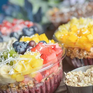 a variety of fruit and oatmeal bowls