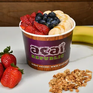 a yogurt with fruit and granola