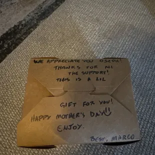an envelope with a note attached to it