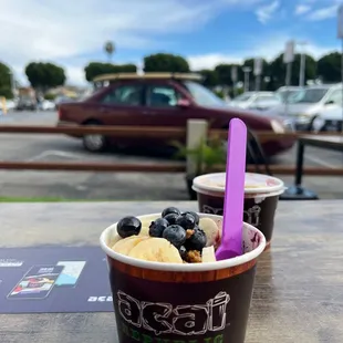 a cup of ice cream with blueberries