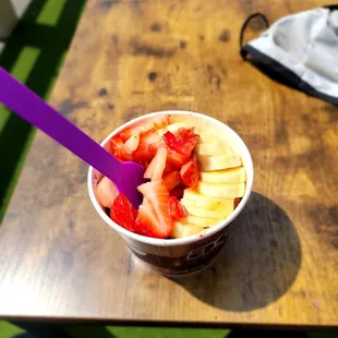 a bowl of fruit on a table