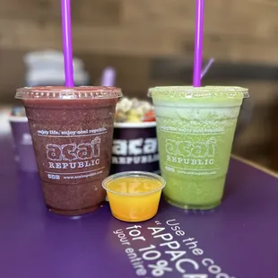 three smoothie drinks on a table
