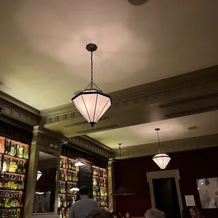 a group of people sitting at a bar