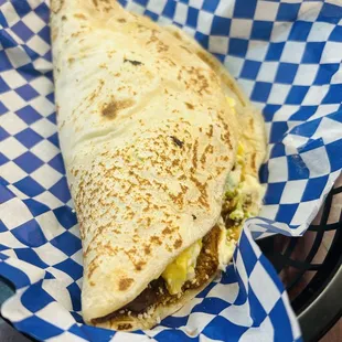 Baleadas supreme, enormous tortilla filled with avocado chill eggs and who knows what else for $11 with tax.  A meal by itself