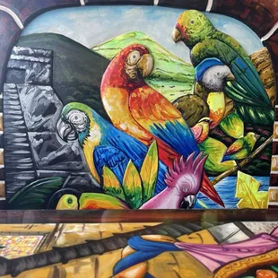 a colorful mural of parrots