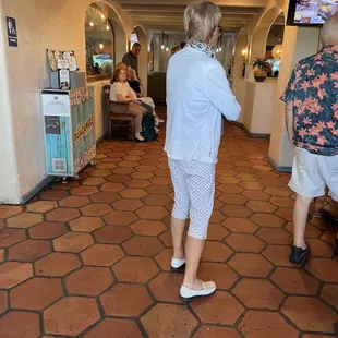 a woman standing in a hotel lobby