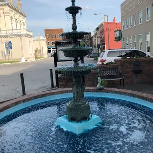 a fountain in the middle of a street