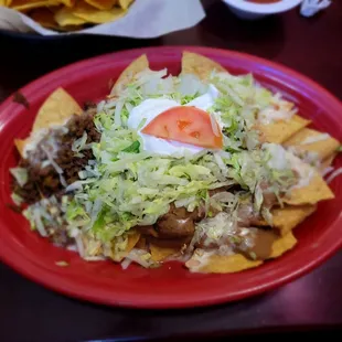 Nachos Deluxe. Nice portion, lots of toppings...but with queso instead of melted shredded cheese, not specified in the menu. Got soggy.