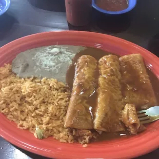 Enchilada combination plate. Beef and chicken enchiladas. I added the cheese enchilada ala carte. Comes with means and rice. Yummy