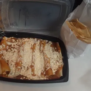 Second half of Enchildas not being baked. Will freeze for another night. Plus a bag of tortilla chips.