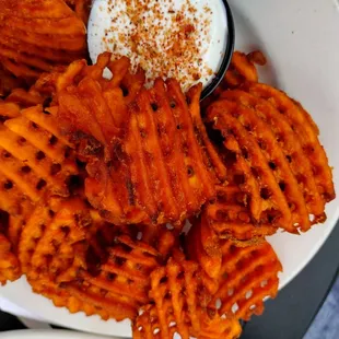 Sweet potato fries and seasoned sour cream