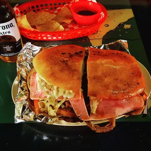 Torta CUBAÑO! It's 10" long &amp; 8" wide, stacked with ham, steak, pork, chorizo, cheese, peppers, onions, tomato, avocado and LOVE!