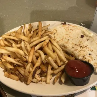 My daughters quesadilla with fries.