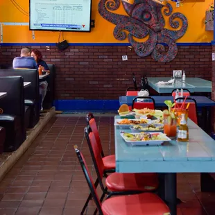 a dining area with tables and chairs