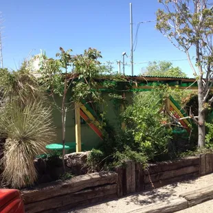 Outside seating and back of restaurant