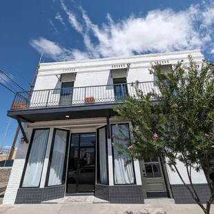 the front of a building with a balcony and balconies