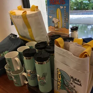 a variety of coffee cups and mugs on a table