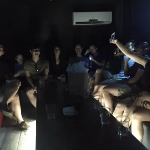 a group of people in a dark room