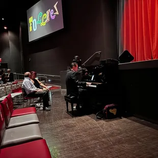 He played and sang until curtain time.