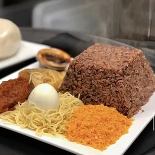 a plate of food with rice and meat