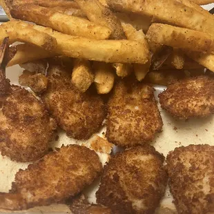 fried chicken and french fries in a styrofoam container