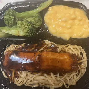 a hot dog with noodles and broccoli