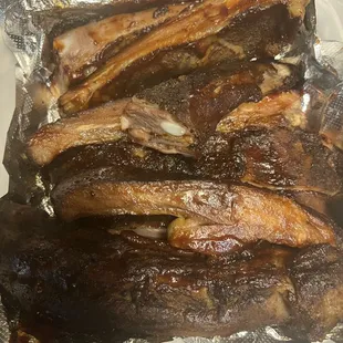 a pile of ribs on foil