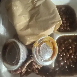 Supposed to be a brisket dinner with Mac n cheese &amp; baked beans. No, nothing is under that random bread either.
