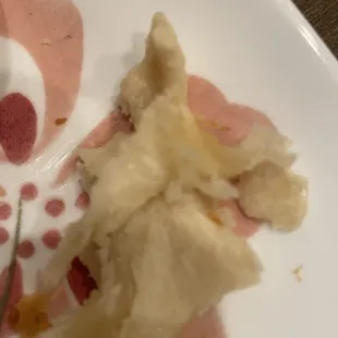 Chunks of dough inside the ham and cheese croissant.