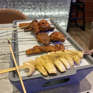 Wings, beef, lamb and octopus