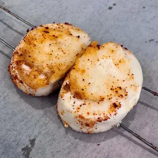 Sliced steam bun on a skew