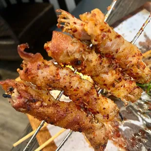 Enoki wrapped with bacon/fatty pork