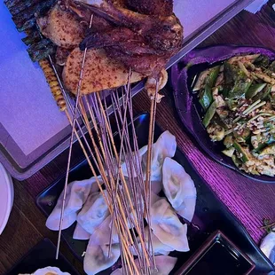 New Orleans house chicken on top, garlic scallop vermicelli bottom left