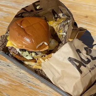 Burger with runny fried egg and bacon.