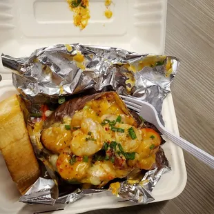 Cajun Shrimp loaded potato with a lobster sauce