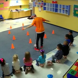 Soccer coaching indoors while it rains outdoors