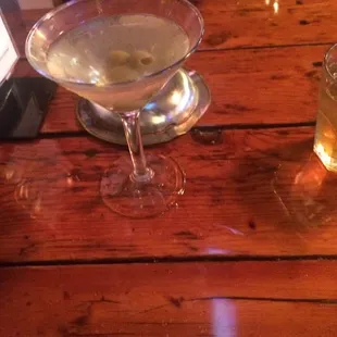a martini on a wooden table